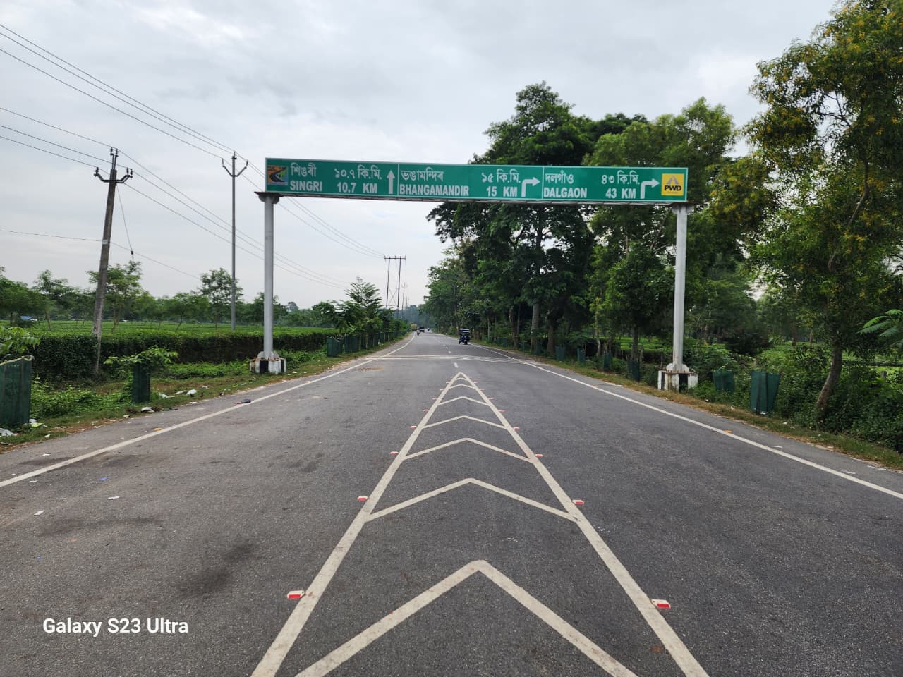 Finished highway with directional signage in Assam
